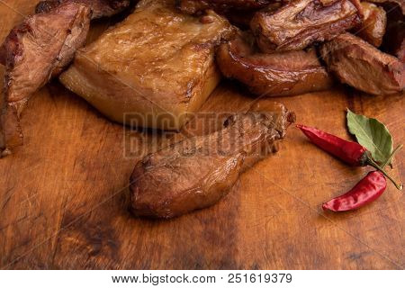 Smoked Meat And Lard With Meat Veins On A Wooden Red Pepper Board With Copyspace