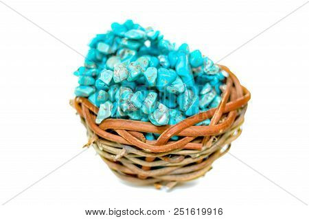 Pile Stones Of Raw Turquoise In Small Wooden Nest On A White Background. Blue And Green Color Stones