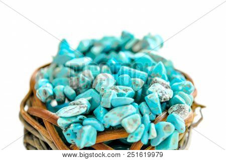 Pile Stones Of Raw Turquoise In Small Wooden Nest On A White Background. Blue And Green Color Stones