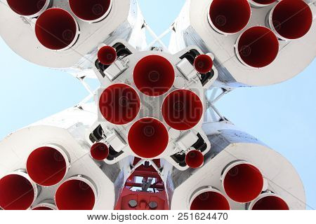 Space Rocket Engines Of The Spacecraft Over Blue Sky. Cosmic High Tech Background