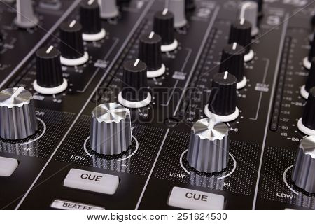 Dj Mixer Controller. Knobs And Switches Of Black Audio Mixing Console In Nightclub. Selective Focus.