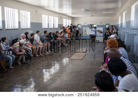 Robben Island Prison, South Africa,february 2015, Tourists Listening To A Tour Guide Inside The Pris