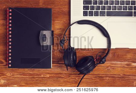 Top View Laptop Headphones Diary Book On Dark Vintage Wooded Table Vintage Look