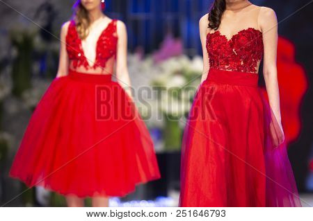 Sofia, Bulgaria - 28, March 2018: Female Models Walk The Runway In Red Dresses During A Fashion Show