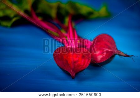 Beetroot Cut In Half On A Blue Background, Place For Text, Healthy Food