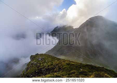 Summer Landscape With High Mountains And Clouds In A Summer Day
