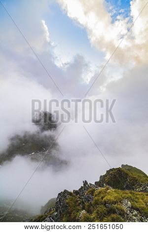 Summer Landscape With High Mountains And Clouds In A Summer Day