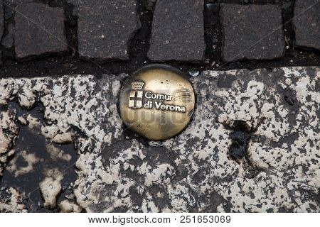 Verona, Italy, April 23, 2016 - Plate Road With Symbol Of The City Of Verona, Italy