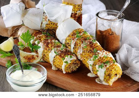 Delicious Fried Corn, Grated With Lime, Poured With Sauce And Seasoned With Spicy Spices. Indian And