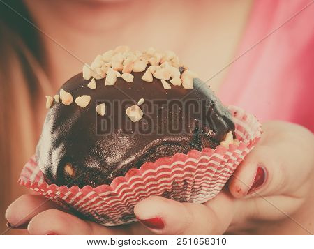 Diet, Sweets, Food Concept. Woman Holding Delicious Chocolate Cupcake With Peanut Frosting About To 