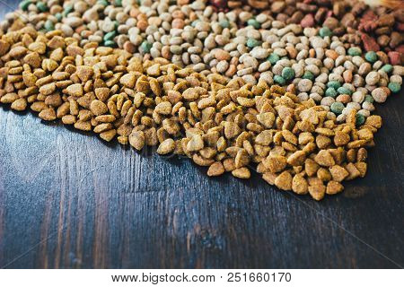 Dry Pet Food For Dogs And Cats On Table.