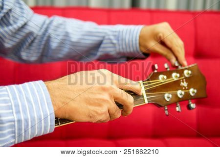 A Man Is Config Guitar, Music Instrument For Happy And Smile Feeling.