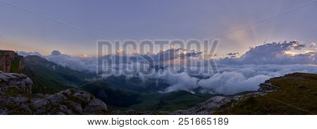 Panorama Of Elbrus Over The Clouds At Sunset. Russia.