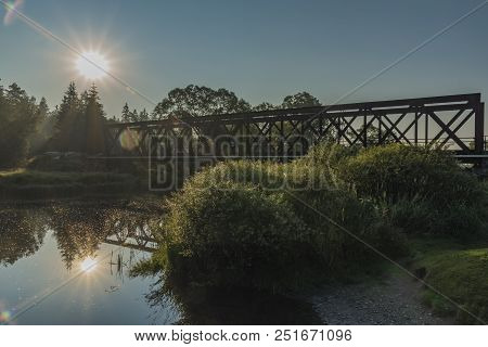Railway Bridge Over Tepla Vltava River In Summer Sunny Morning