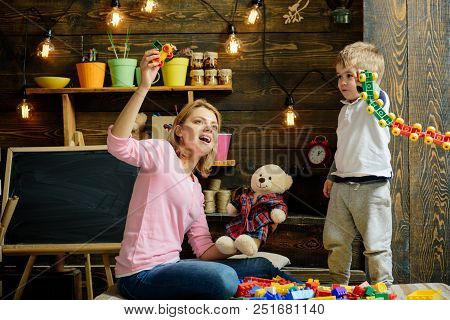 Daycare Concept. Little Child Play Daycare Game With Woman. Daycare Preschool. Family Daycare. Fun P
