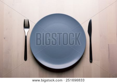 Top View Of A Restaurant Table With Plate, Knife And Fork, Restaurant Concept