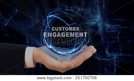 Painted Hand Shows Concept Hologram Customer Engagement On His Hand. Drawn Man In Business Suit With