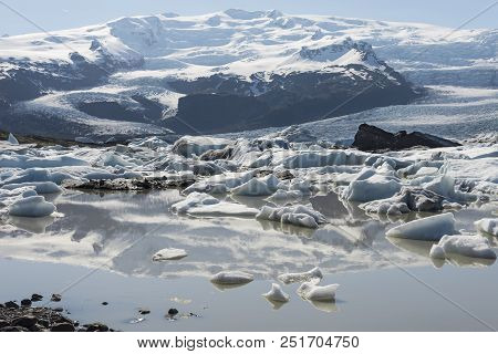Fjallsárlón Glacier Lagoon In Southeast Iceland Showing Floating Icebergs.