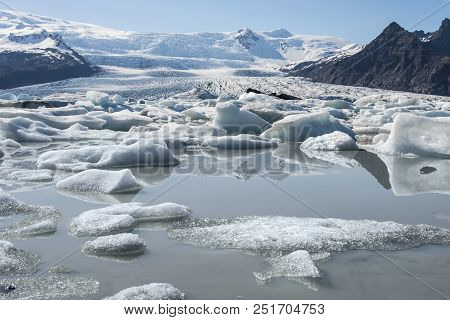Fjallsárlón Glacier Lagoon In Southeast Iceland Showing Floating Icebergs.