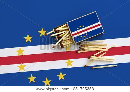 Cabo Verde Flag  Is Shown On An Open Matchbox, From Which Several Matches Fall And Lies On A Large F