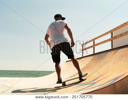 The Guy Skates On A Ramp. Tricks.