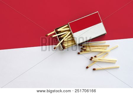 Indonesia Flag  Is Shown On An Open Matchbox, From Which Several Matches Fall And Lies On A Large Fl
