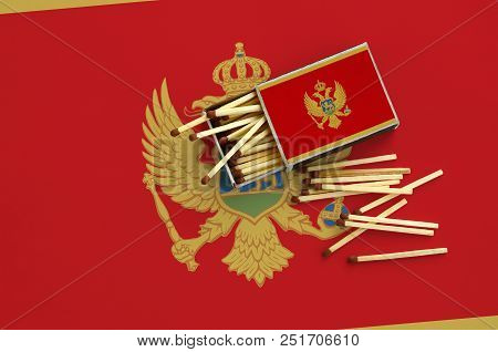 Montenegro Flag  Is Shown On An Open Matchbox, From Which Several Matches Fall And Lies On A Large F