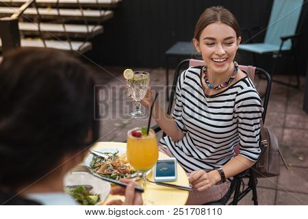 Sentimental Feeling. Smiling Woman Feeling Really Sentimental While Remembering Childhood With Siste