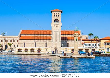 Colossus Of Rhodes And Evangelismos Church Or Ekklisia Evaggelismos In Rhodes Island In Greece