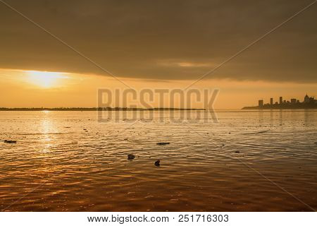 Water Pollution In A River During The Sunset