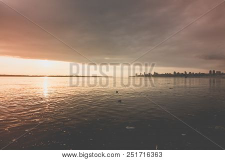 Water Pollution In A River During The Sunset
