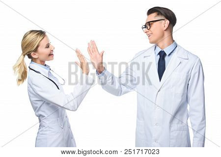 General Practitioners In White Coats Giving Highfive, Isolated On White