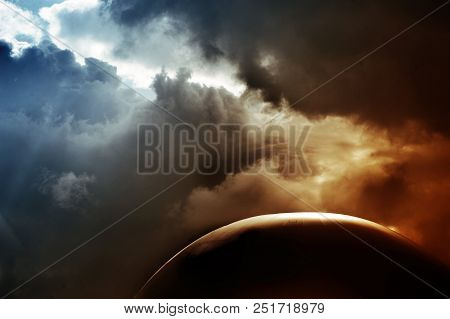 Big Ball Against The Background Of Clouds And Sky