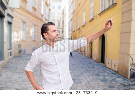 Man Tourist Taking Selfie On Old Strett Outdoors
