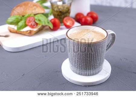 Dutch Lunch With A Sandwich And Fragrant Coffee. Fresh Bread With Mazarella Cheese, Cherry Tomatoes 