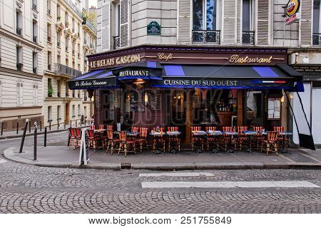 Paris, France - August 10, 2017. Typical Paris Street With French Restaurant Le Relais Gascon With S