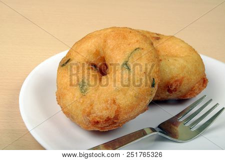 Sambar Vada Or Medu Vada Is A Very Popular South Indian Food On Wooden Background