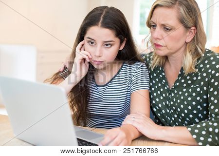 Mother Comforting Daughter Victimized By Online Bullying