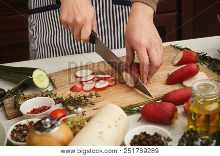 Woman Cutting Fresh Radish On Wooden Board. Natural Eating, Preparing Healthy Dietic Vegetable Salad