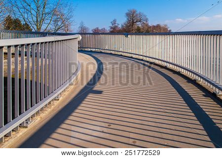Pedestrian Overpass With Metal Raillings On Sunny Day.