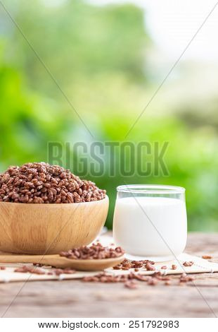 Breakfast Cereal, Puffed Rice With Cocoa In Bowl And Glass Of Milk On Wooden Table