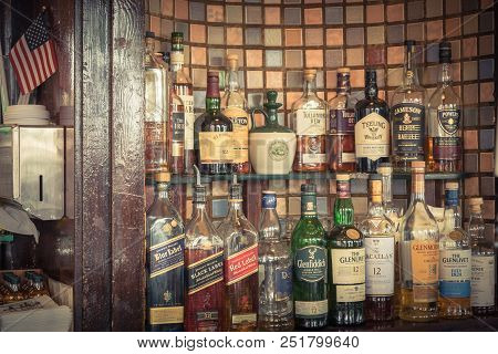 Assortment Of Liquor Alcoholic Drink With American Flag In Irish Pub, San Francisco
