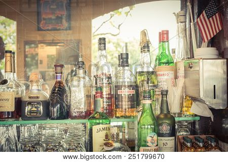 Assortment Of Liquor Alcoholic Drink With American Flag In Irish Pub, San Francisco