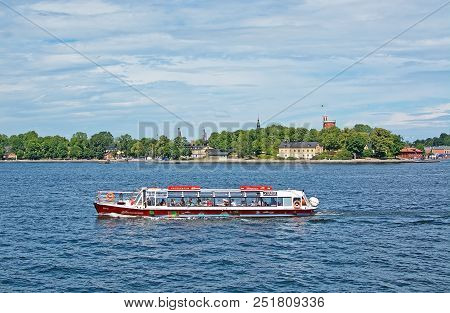 Stockholm, Sweden - July 11, 2018: Boats For Sightseeing And Ferry For Long Distance Travel In Front