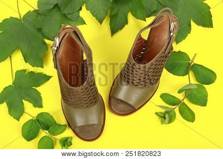 Woman Summer Shoes With Accecories On Yellow Background