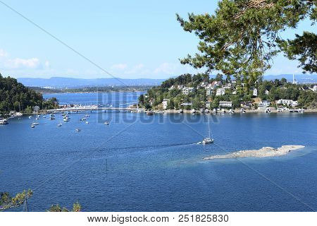 Oslo, Norway - July 22, 2018: View To Oslo Fjord. Two Islands Ormoya And Malmoya Connected To The Ma