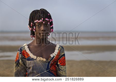 Orango Island, Guinea-bissau - February 2, 2018:  Portrait Of A Beautiful Young Girlr In The Beach I