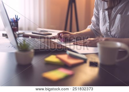 Businesswoman Using An Ink Corrector