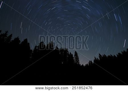 A View Of The Stars Of The Milky Way With A Mountain Top In The Foreground. Night Sky Nature Summer 