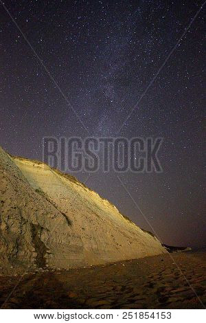 A View Of The Stars Of The Milky Way With A Mountain Top In The Foreground. Night Sky Nature Summer 
